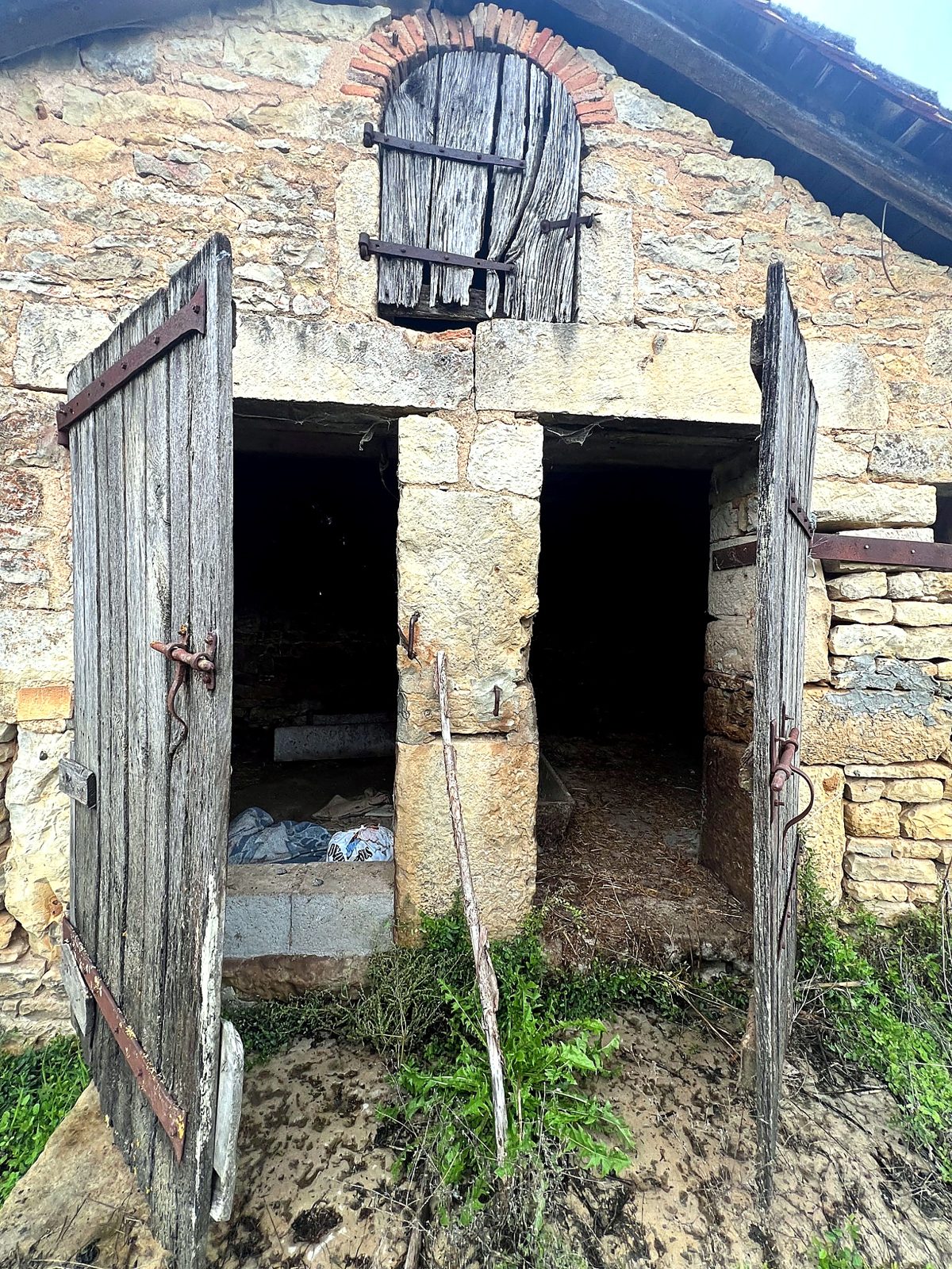 Stone outbuilding with twin doorways