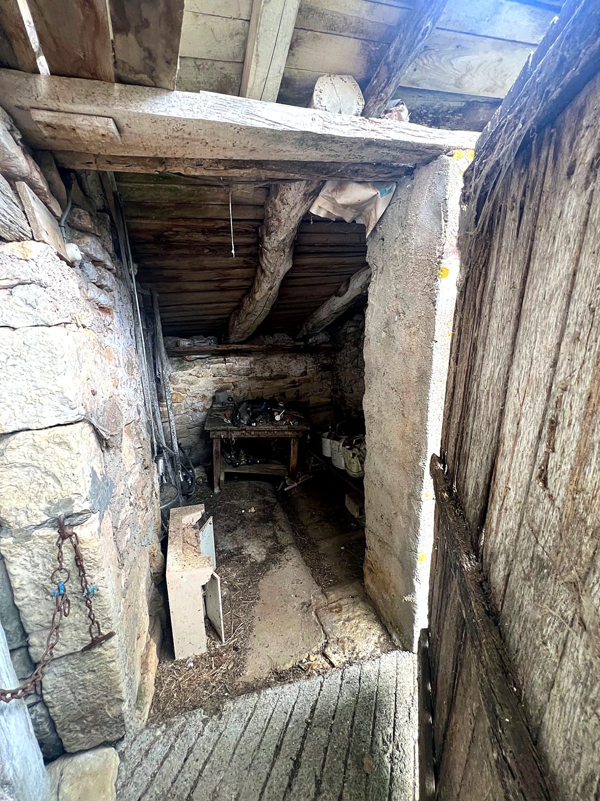 Stone outbuilding doorway with timber lintel
