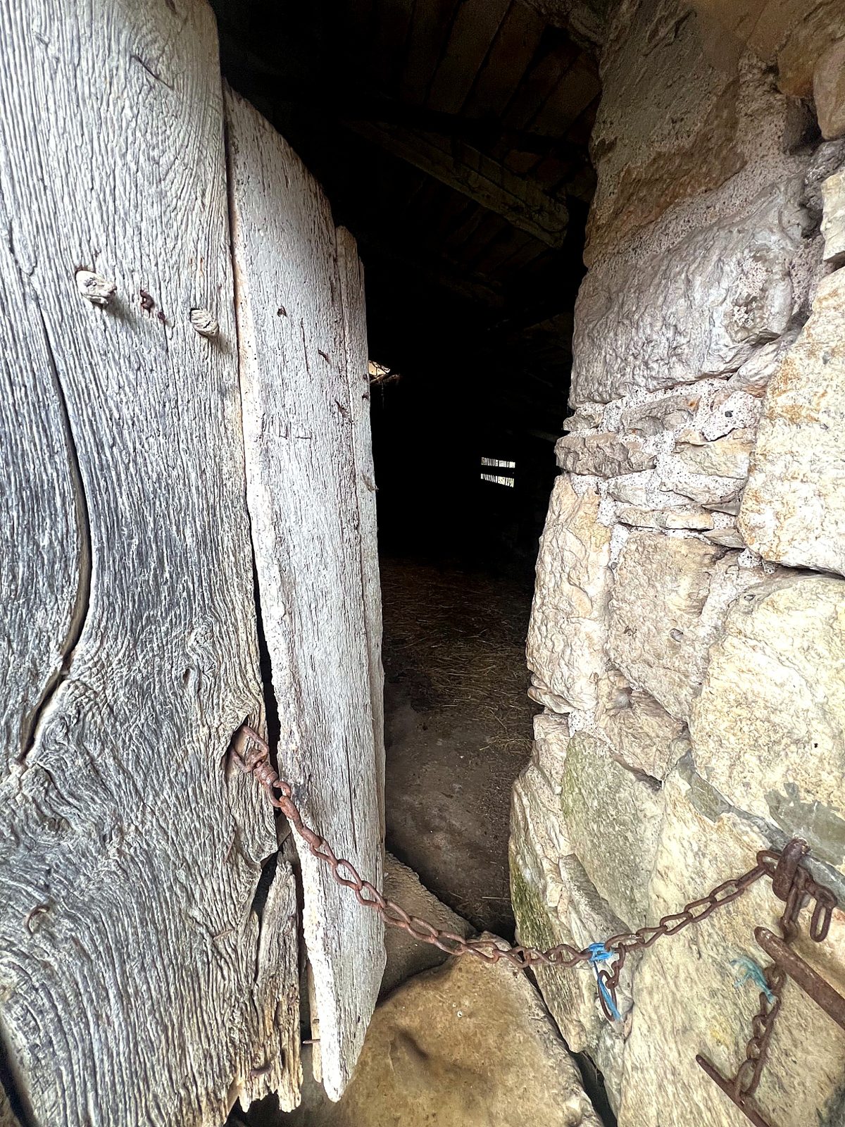 Timber barn door and stone jamb