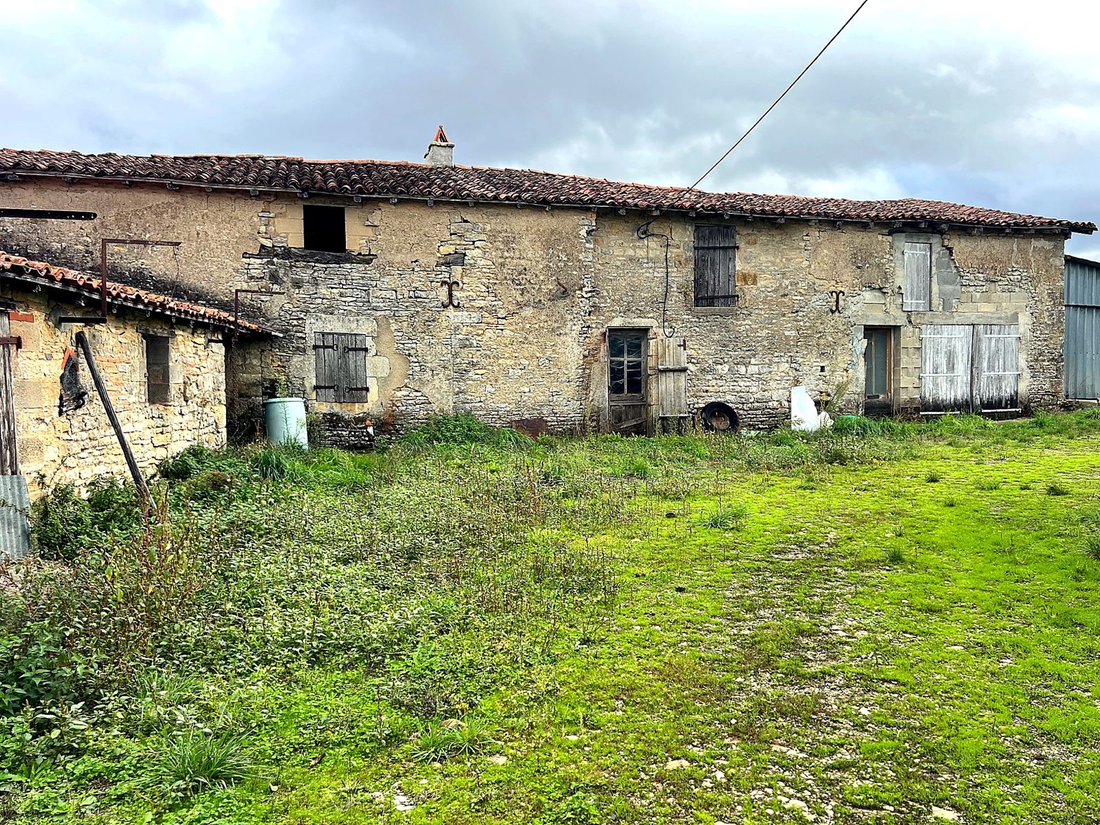 Stone farm buildings around the yard